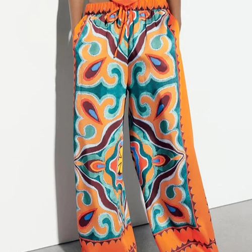 PANTALON ESTAMPADO NARANJA Y AZUL